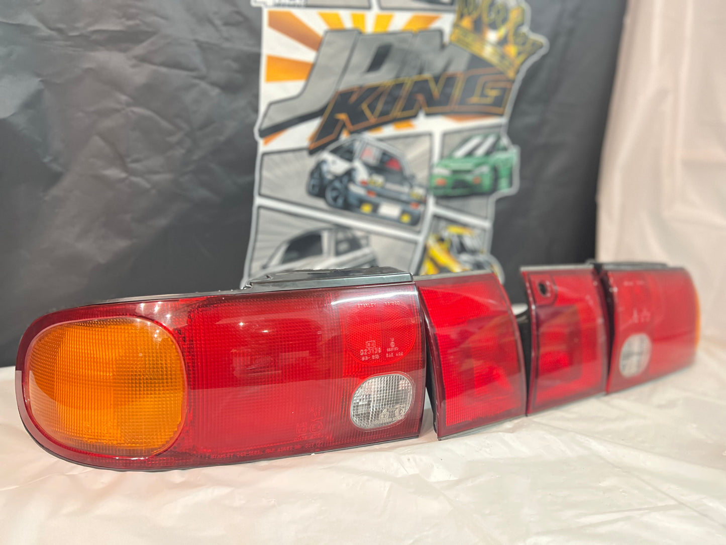 Mitsubishi Lancer Evolution 1-2-3 Tail Lights + rear reflector lights (discontinued item) sold as a set.