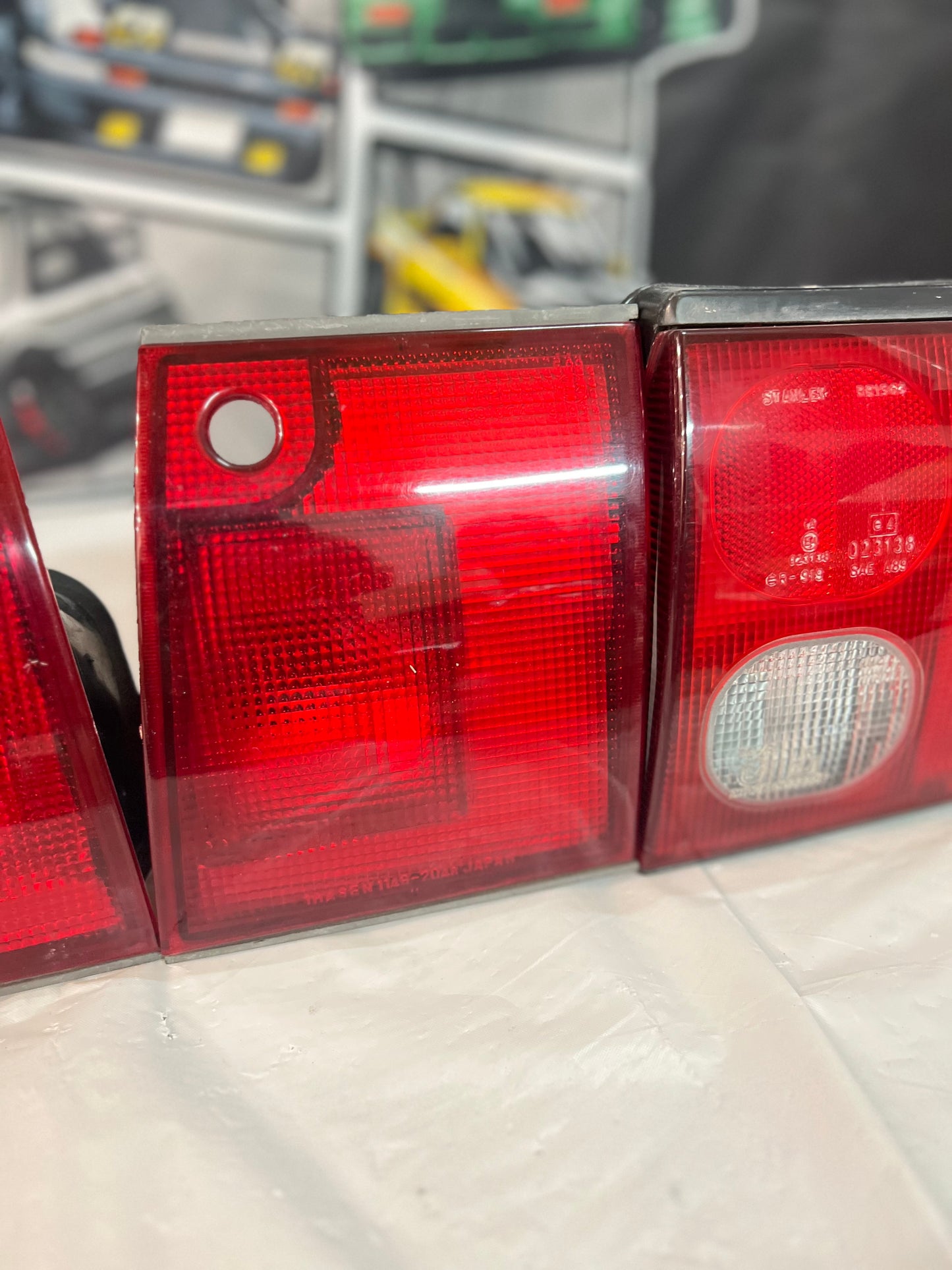 Mitsubishi Lancer Evolution 1-2-3 Tail Lights + rear reflector lights (discontinued item) sold as a set.