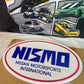 Nizmo old logo wall plaque/sign. Brand new. Quality Embossed steel design. Ideal gift.